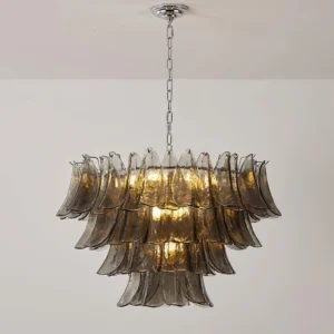 Vivienne chandelier installed ceiling view illuminated with warm glowing light and chrome suspension chain