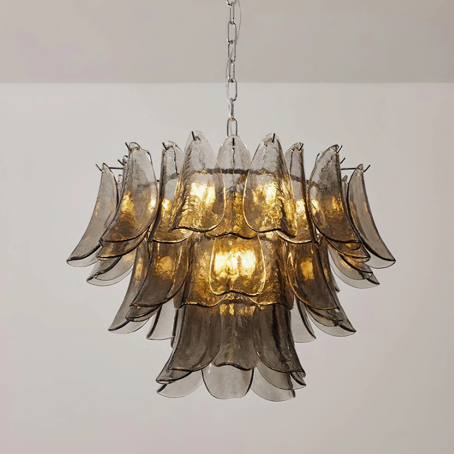 Vivienne glass chandelier three-quarter front view with tiered smoke-gray glass panels and warm ambient lighting