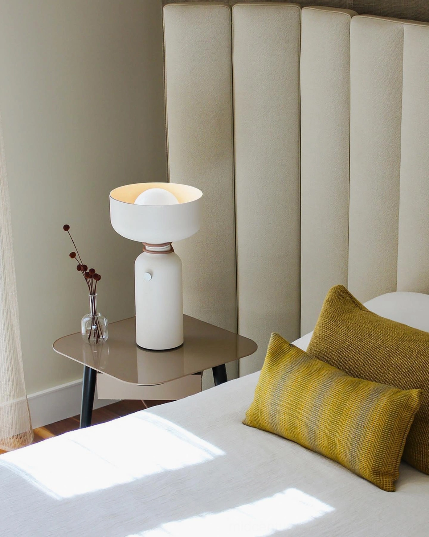 Vol black table lamp illuminated showing warm light output and bowl shade direction