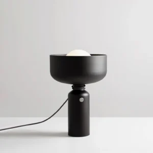Vol black table lamp three-quarter angle with spherical inner bulb and round base switch