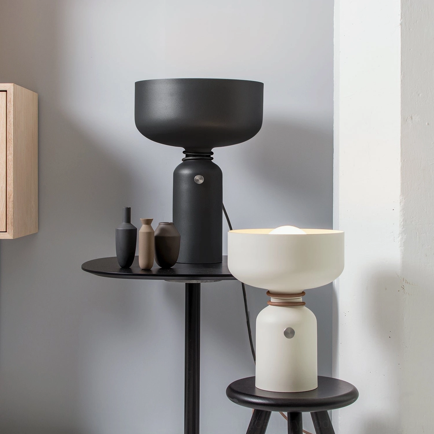 Vol table lamps paired display black and off-white minimalist room setting with ceramic vases