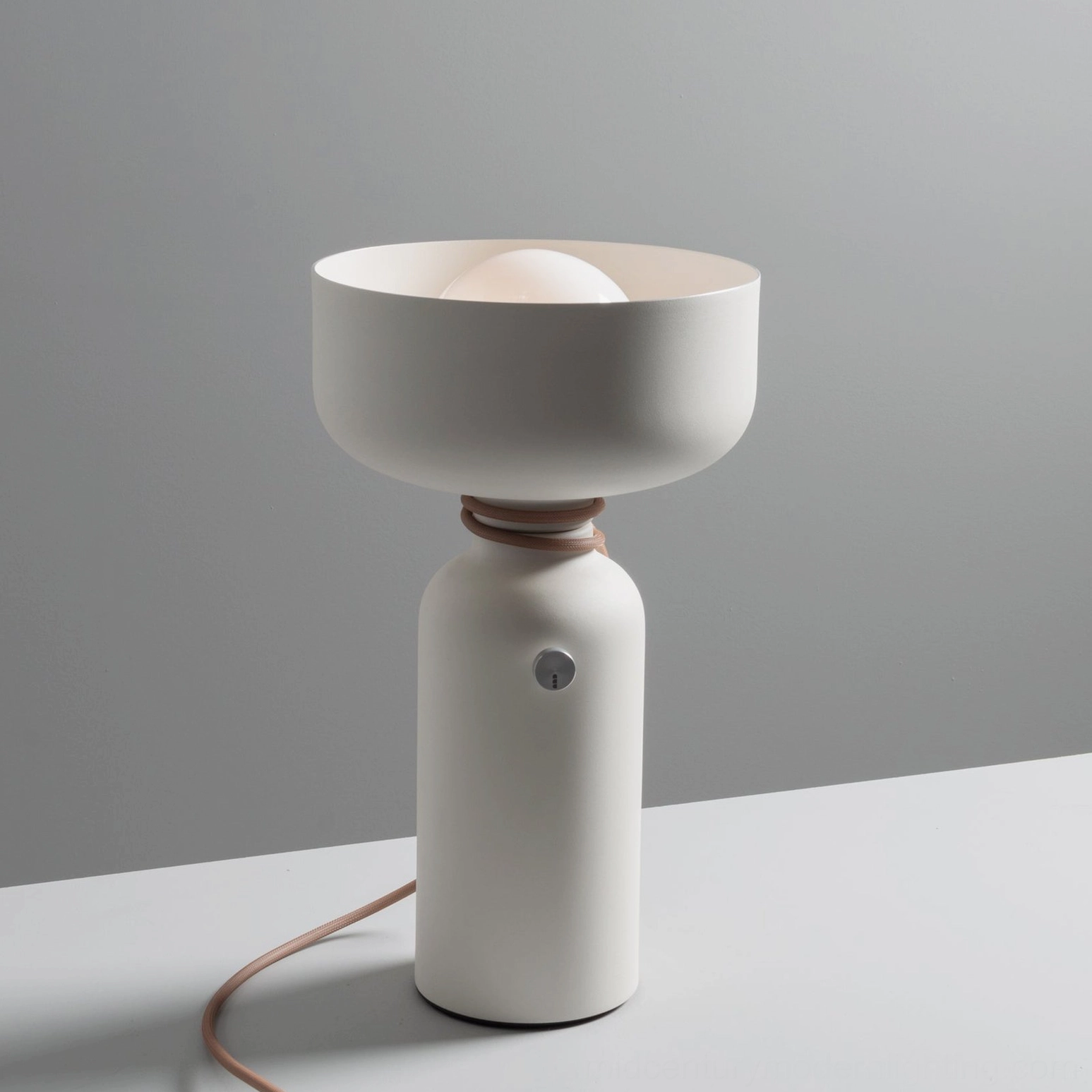 Vol off-white table lamp side frontal view with tan accent ring and brown fabric cord
