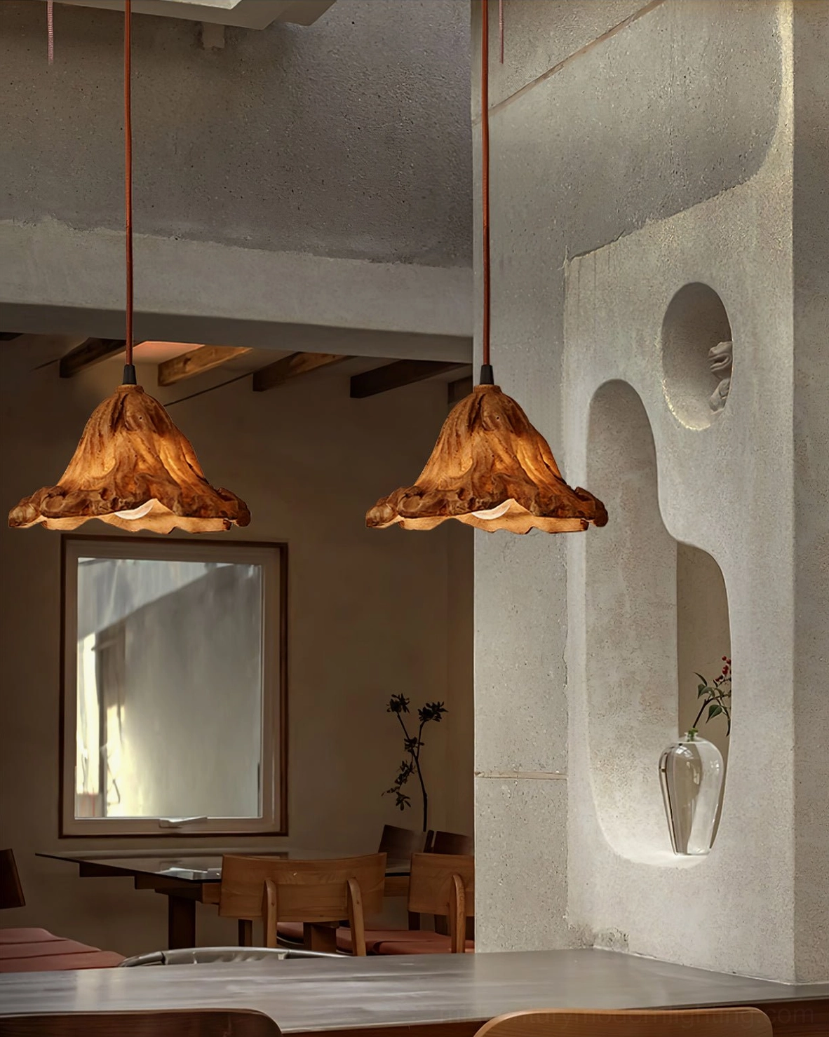 Brown Volcano pendant lamps in rustic cafe interior with exposed concrete walls and wooden beam ceiling