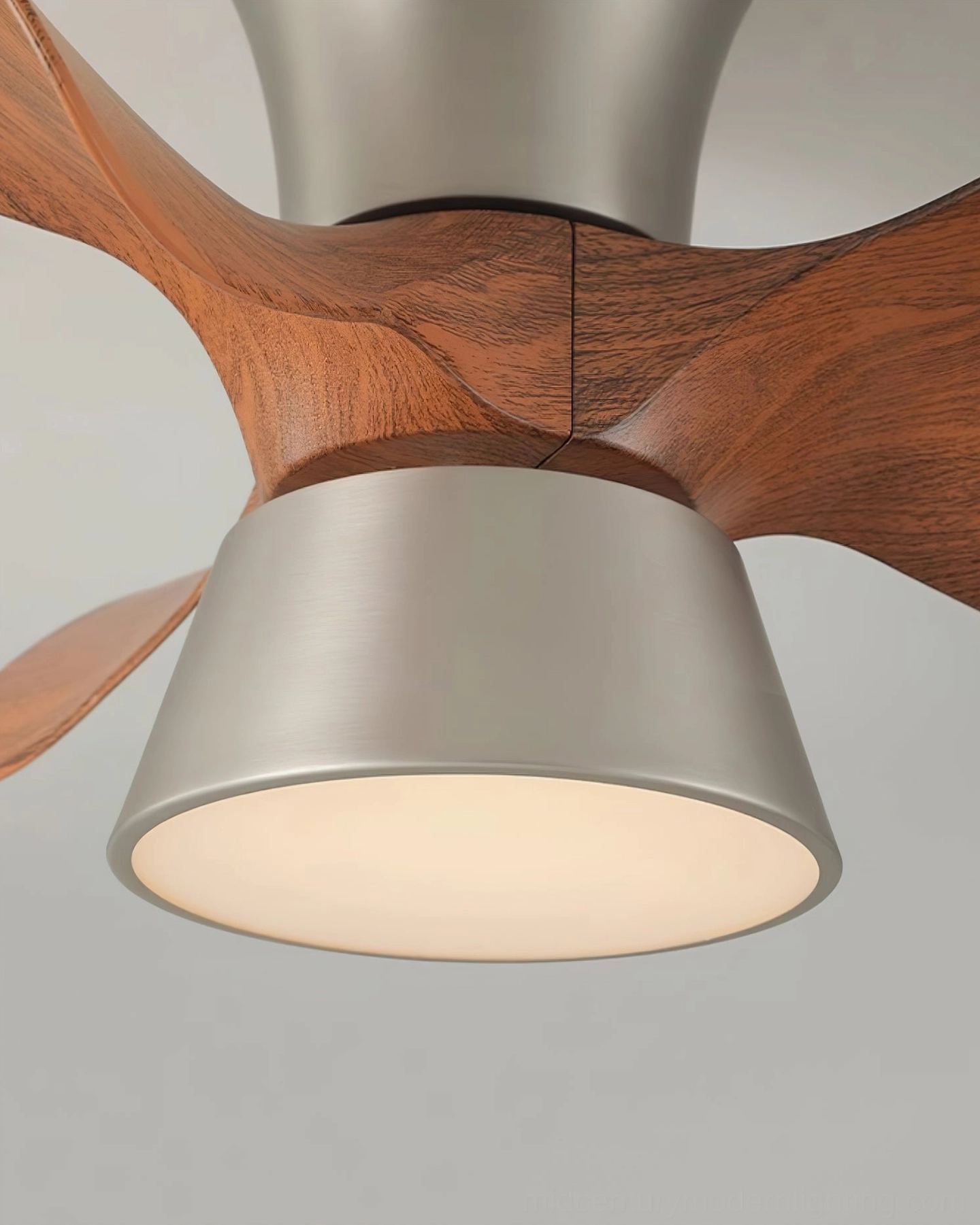 Volos ceiling fan light close-up detail showing walnut wood grain texture and brushed nickel lamp housing