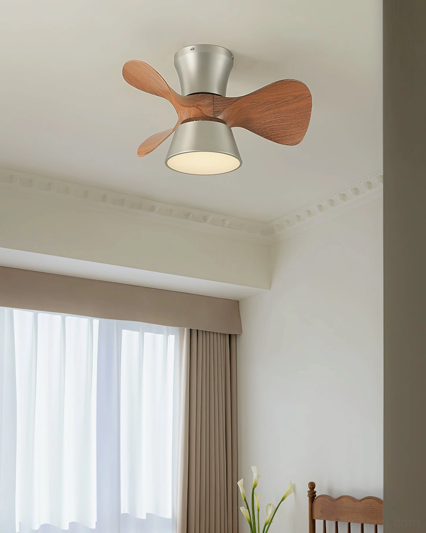 Flush-mount ceiling fan light in minimalist living room with large windows and white walls