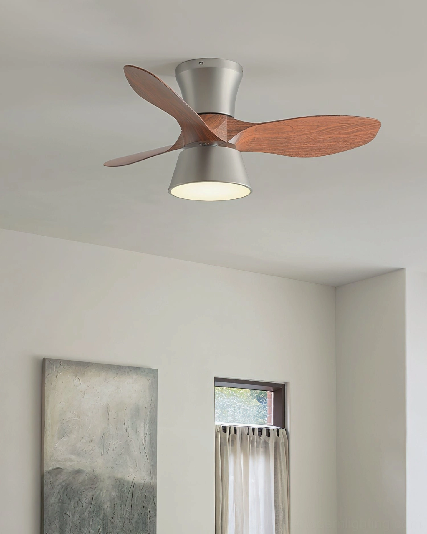 Compact DC motor ceiling fan light in minimalist room with wall artwork and unobtrusive design