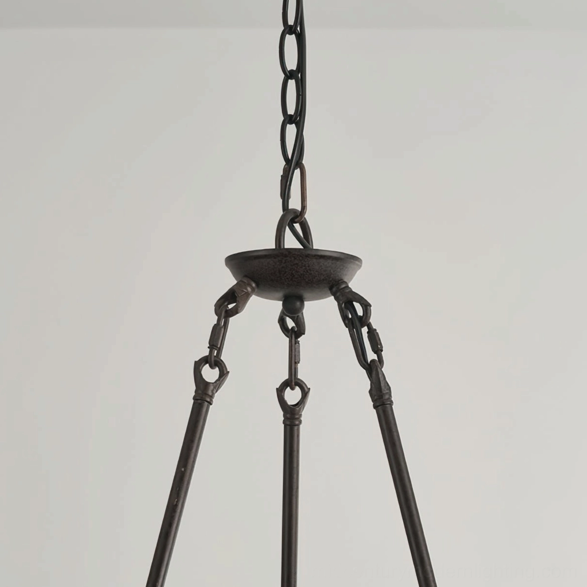 Chandelier suspension components including black metal chain and triangular metal support bracket assembly detail