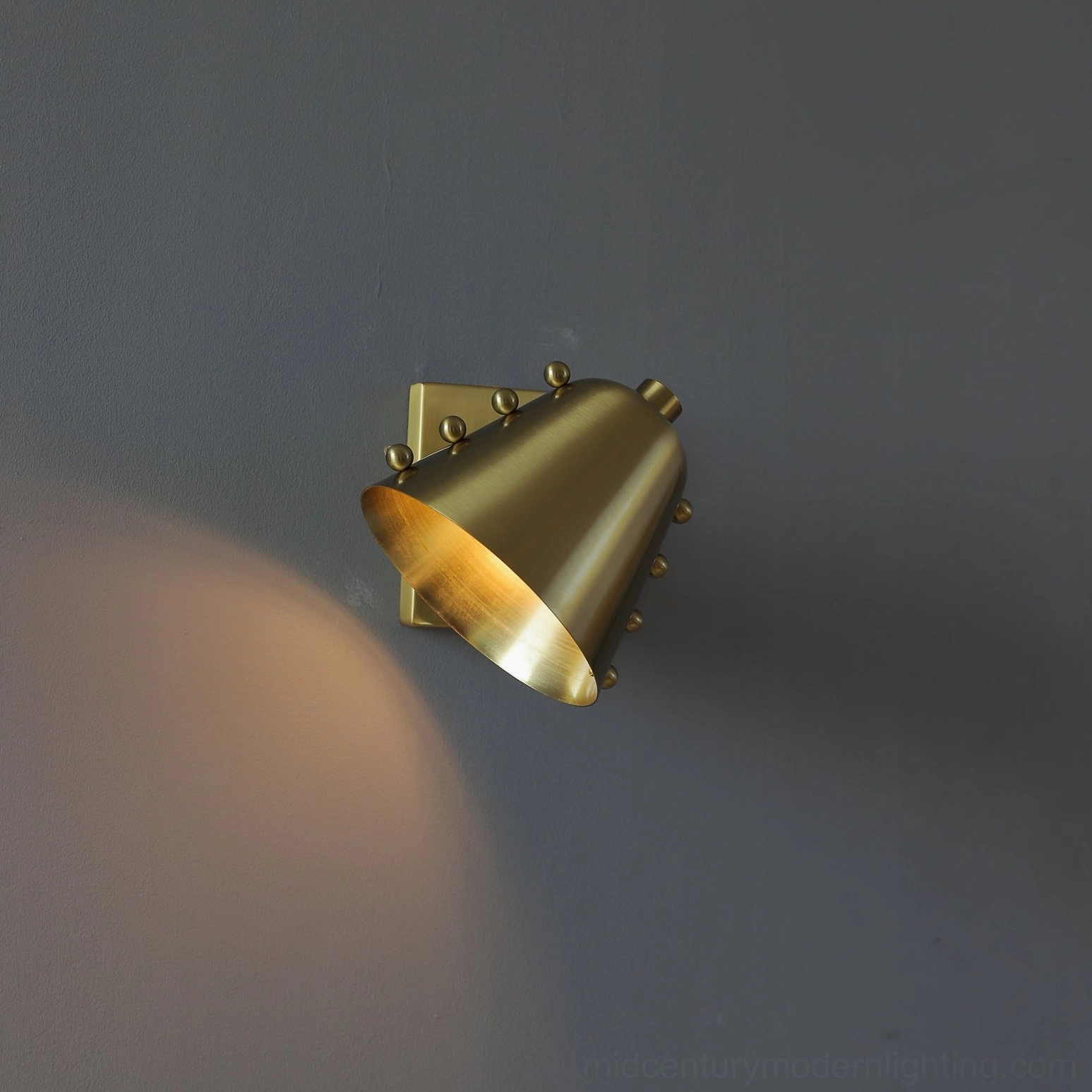 Wall lamp mounting detail showing concealed bracket system and installation precision