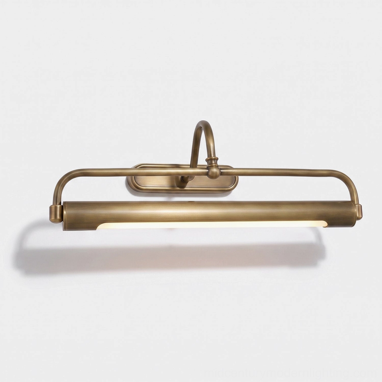 Wall-mounted picture light sconce with brass finish and curved arm, interior design styling