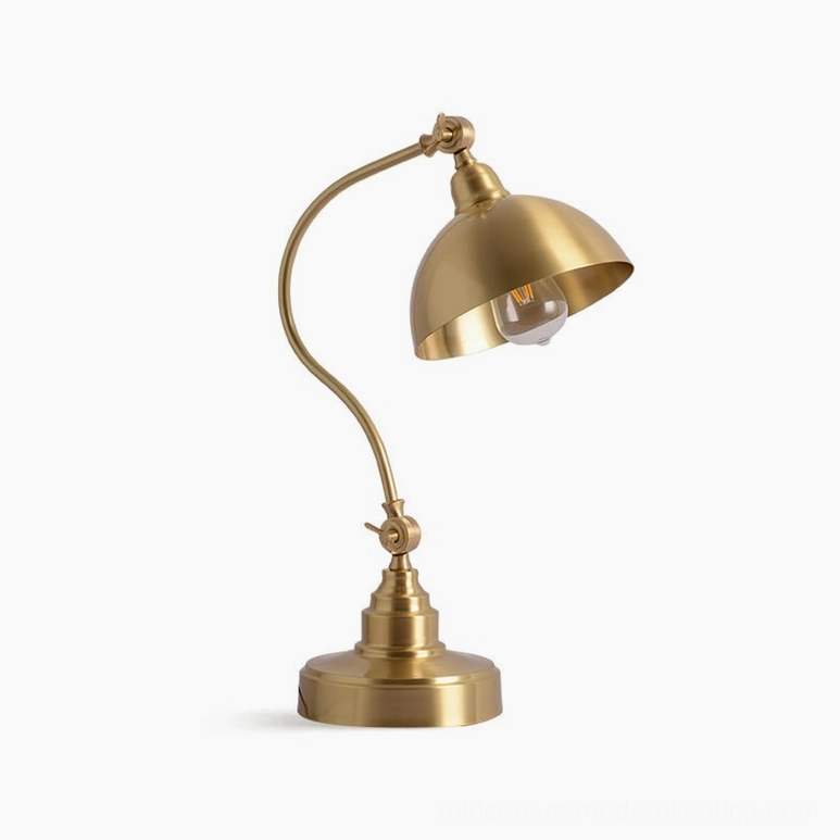 Wallace brass table lamp with exposed Edison bulb, polished gold metal finish, studio lighting