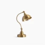 Wallace brass adjustable table lamp with curved arm and dome shade, front three-quarter studio view