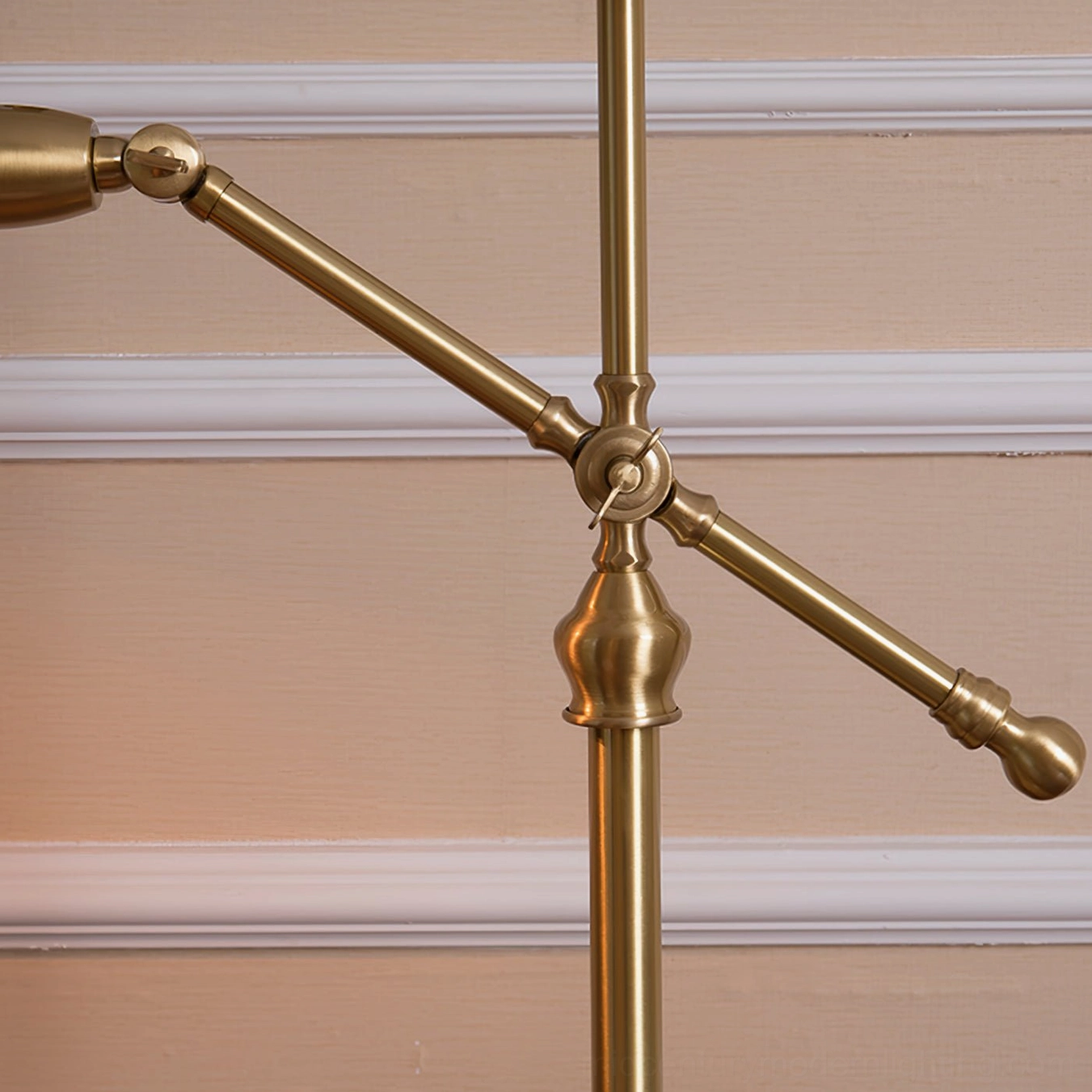 Wallace brass lamp adjustable arm joint mechanism close-up, showcasing dual swing positioning