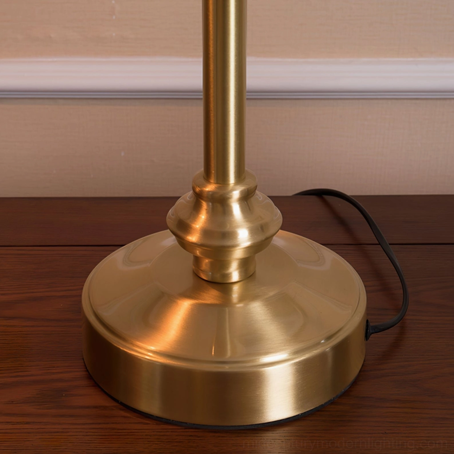 Wallace brass lamp base detail showing solid weighted metal foundation and black power cord