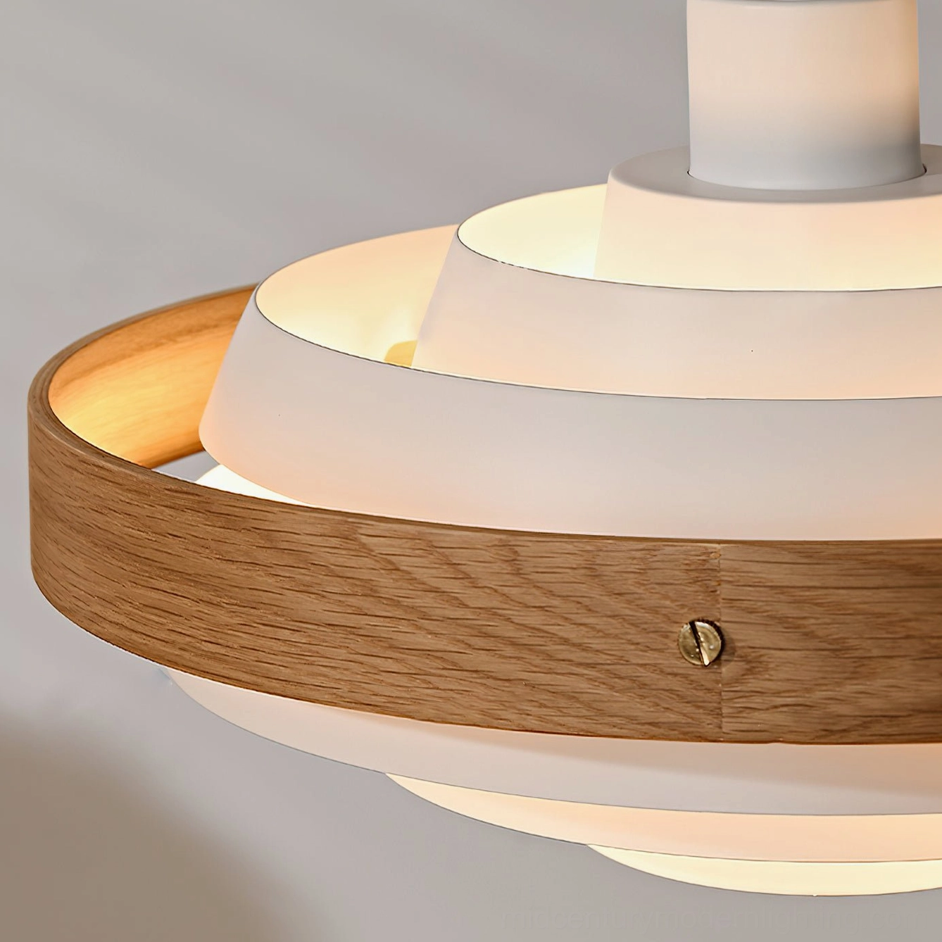 Walnut color swing arm pendant light with black metal arm in warm home interior
