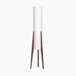 Walnut mid-century modern tripod floor lamp with white linen shade, studio product shot on white background