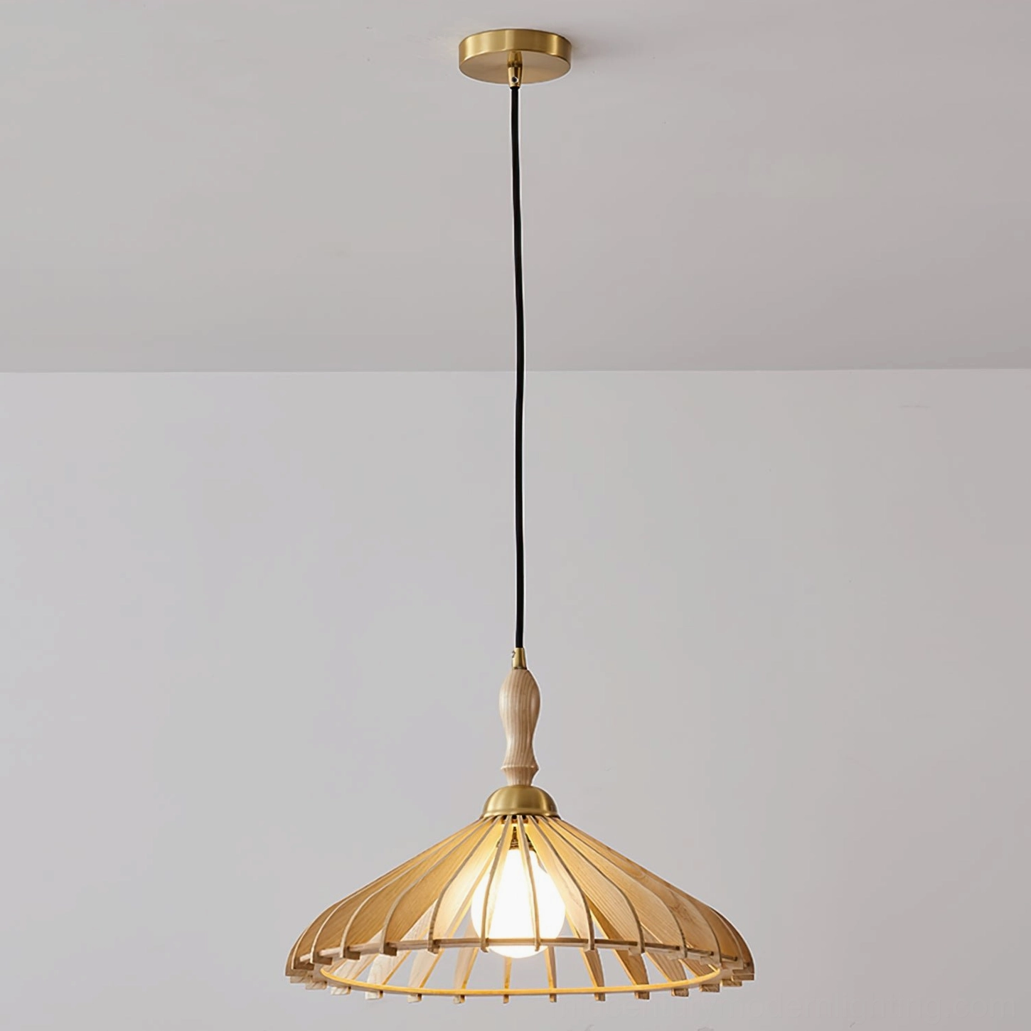 Walnut finish umbrella wood pendant light creating atmospheric dappled shadow patterns on dining table