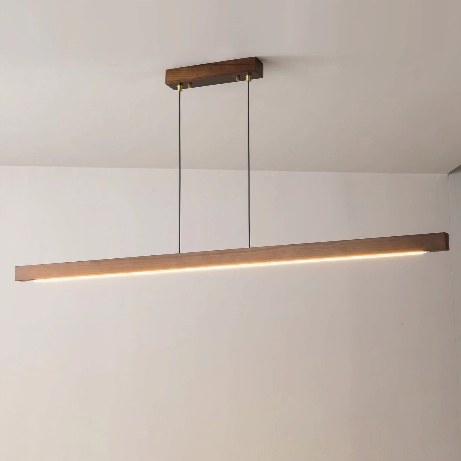 Walnut finish linear pendant light with brass hardware showing wood grain texture and color finish