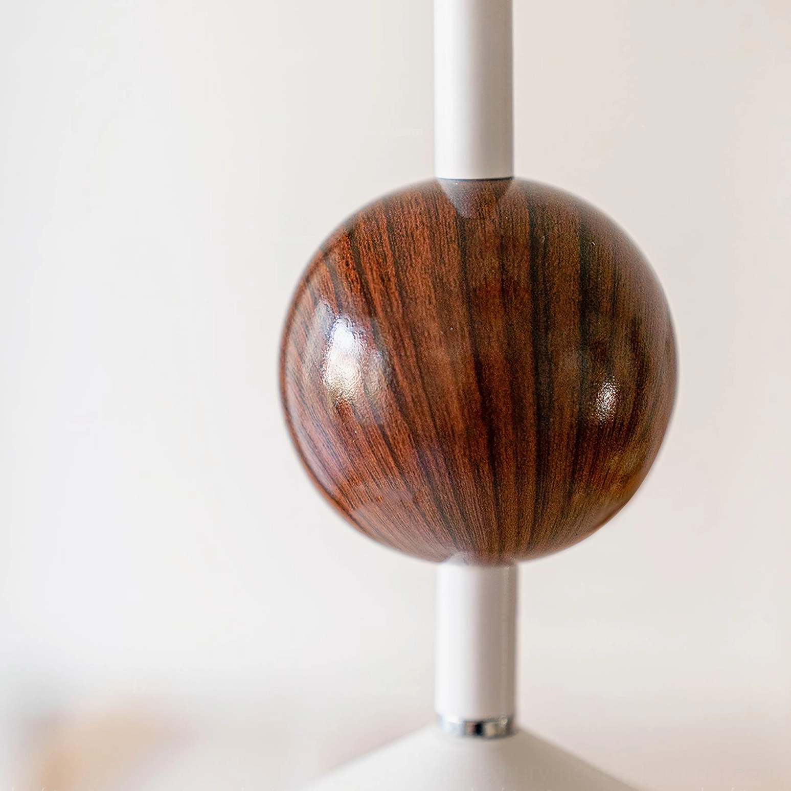 Walnut wood sphere accent on alien pendant lamp showing natural wood grain finish