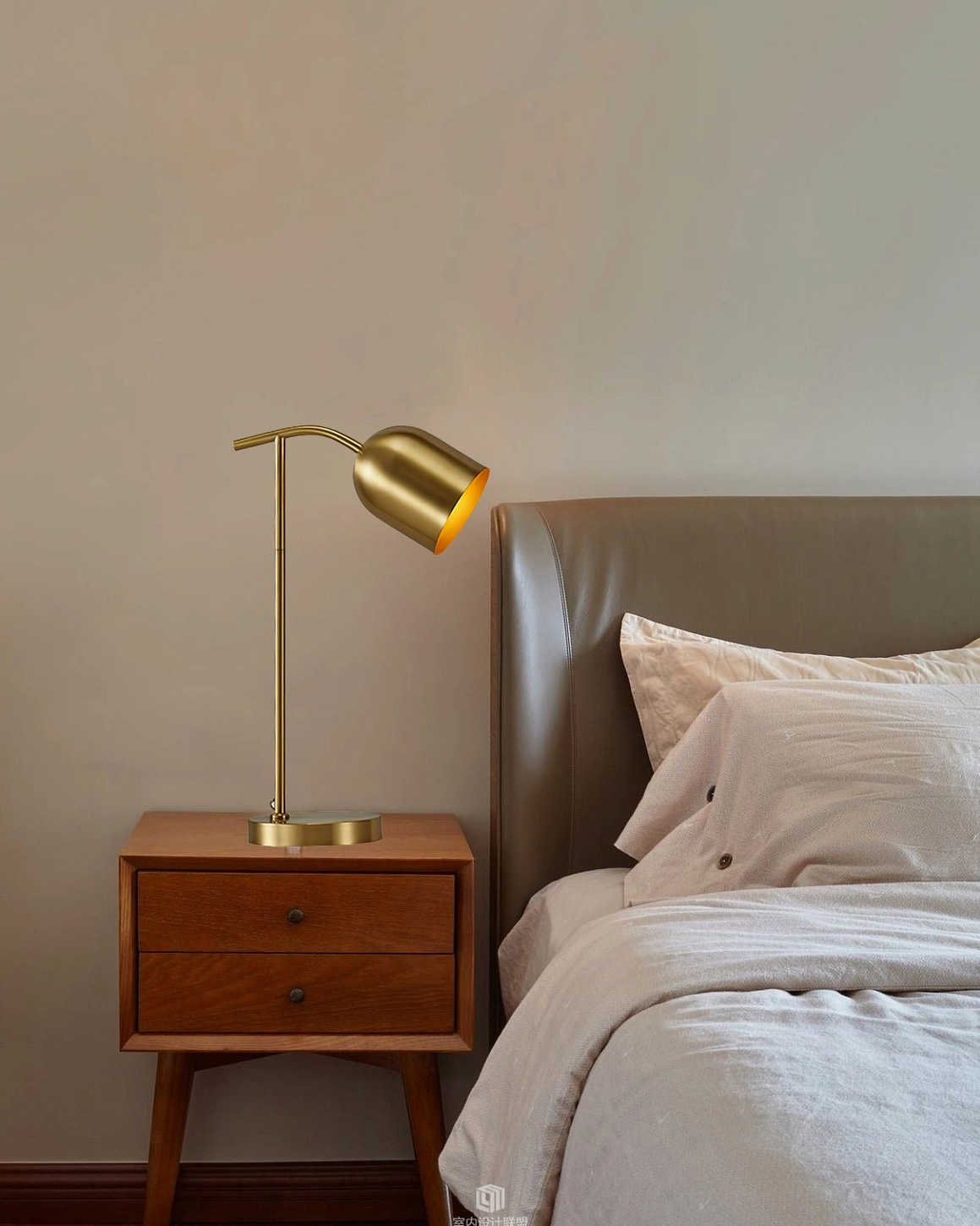 Warm brass gooseneck table lamp bedside lighting on brown wooden nightstand with leather headboard - cozy bedroom aesthetic