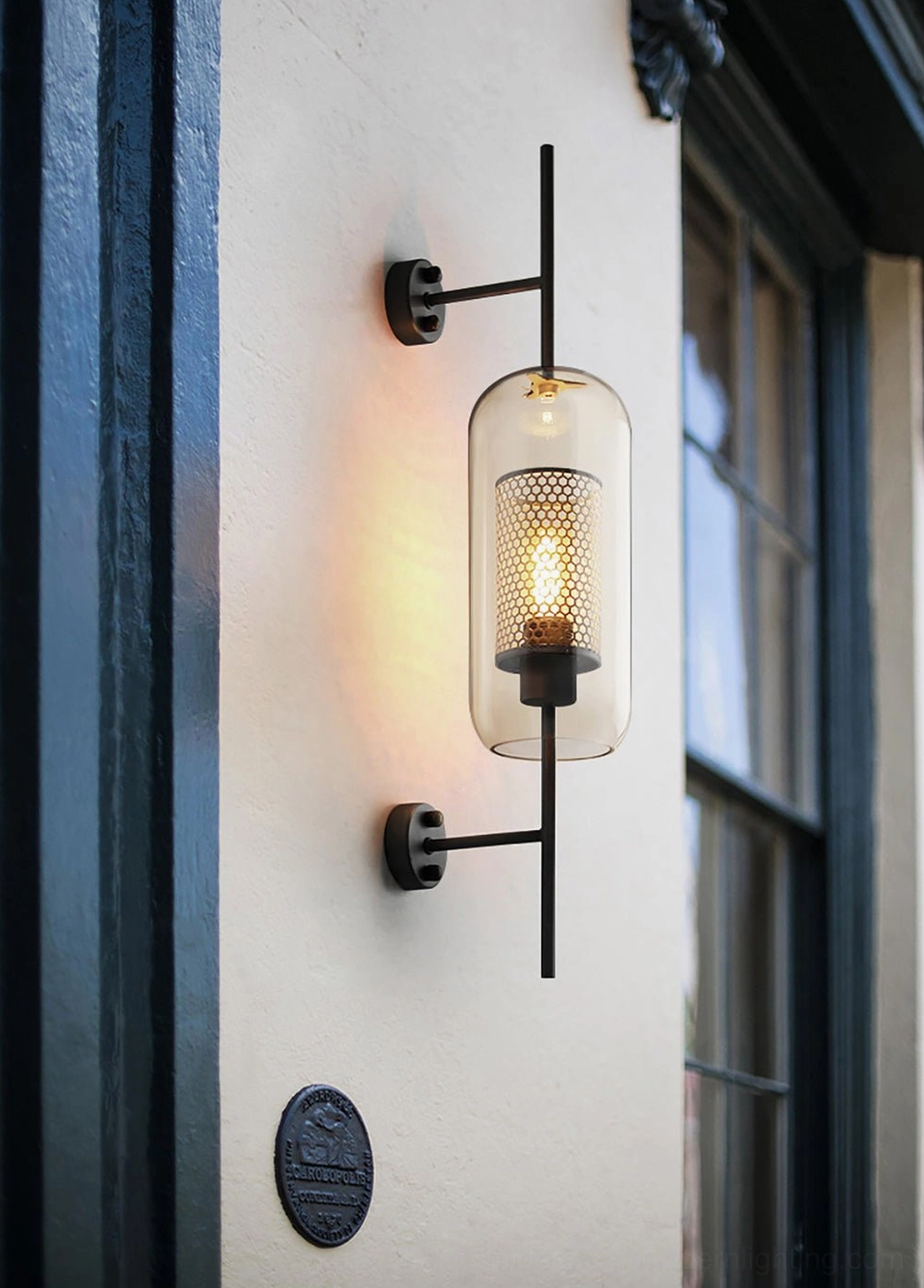 Modern glass wall sconce with warm color temperature and ambient glow effect