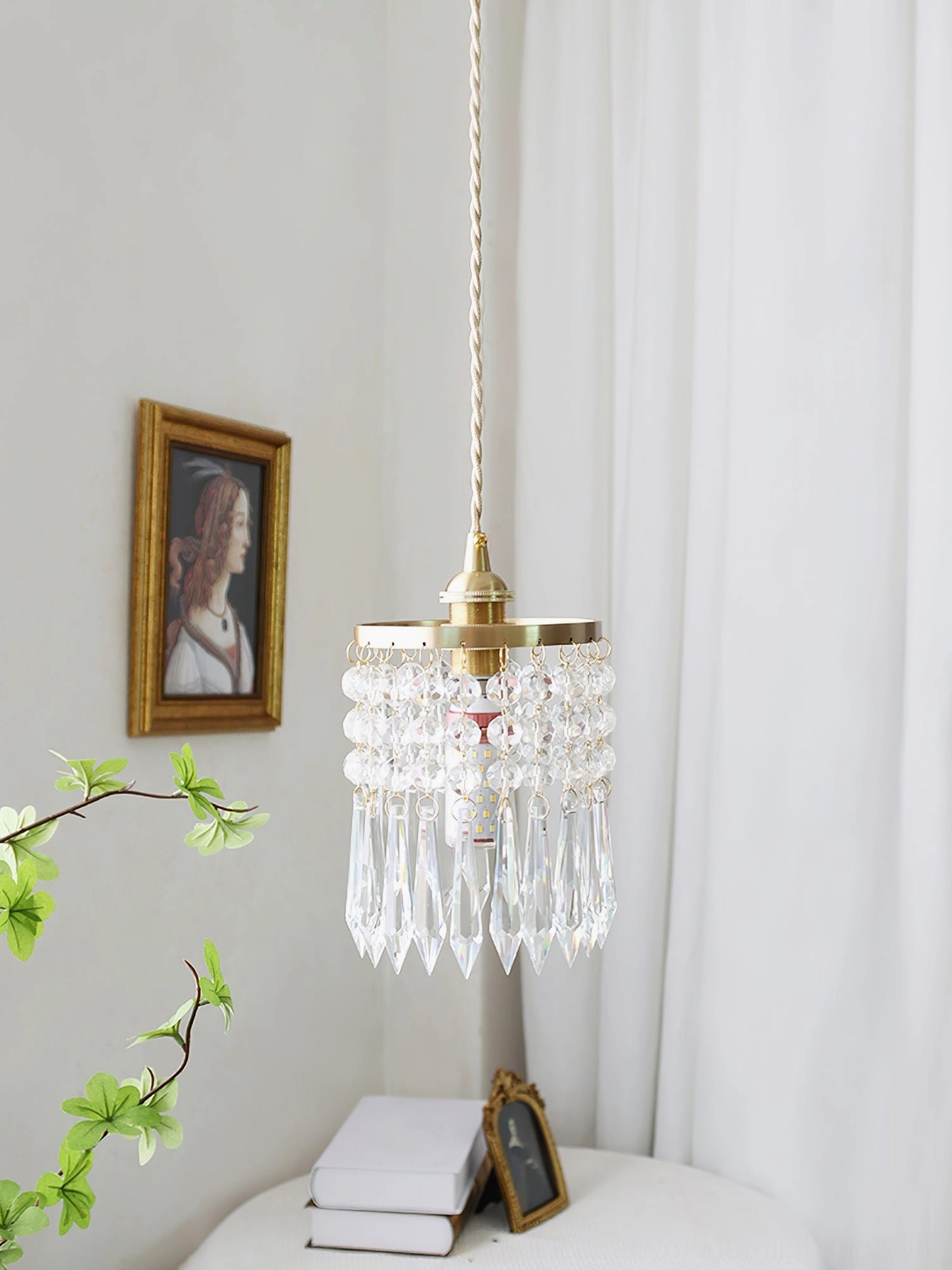 Warm-glowing crystal pendant lamp, intimate home lighting atmosphere