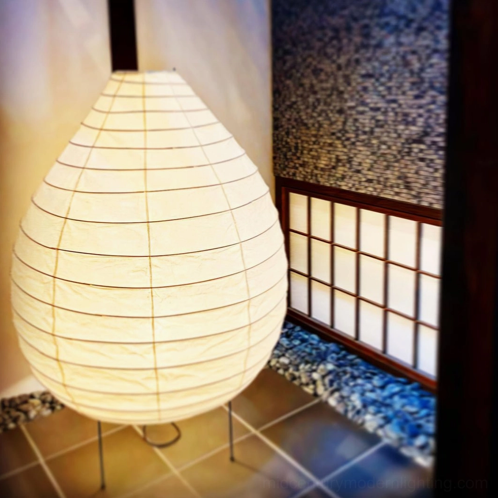 Backlit view of washi paper table lamp revealing subtle weave texture and light diffusion
