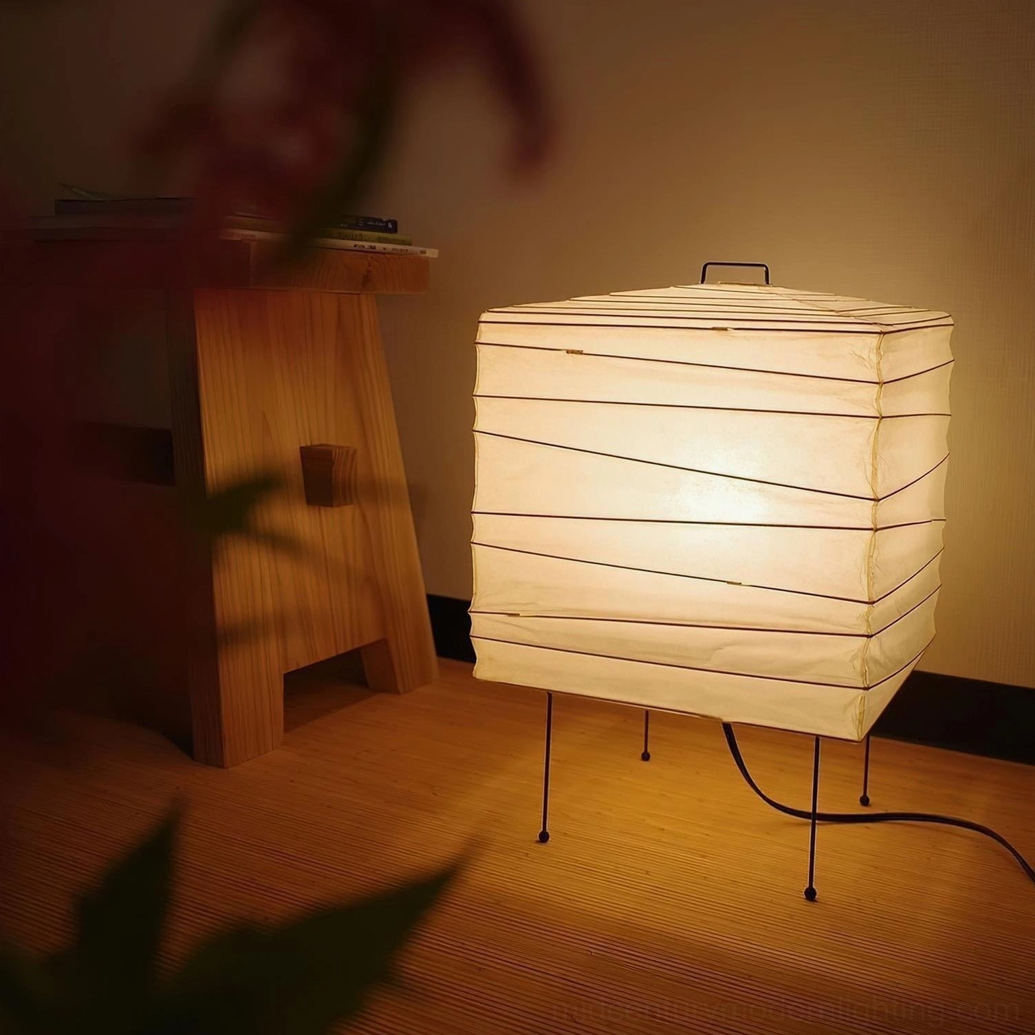 Handmade washi paper table lamp front profile showing clean lines, organic shade form, and white finish on metal frame base