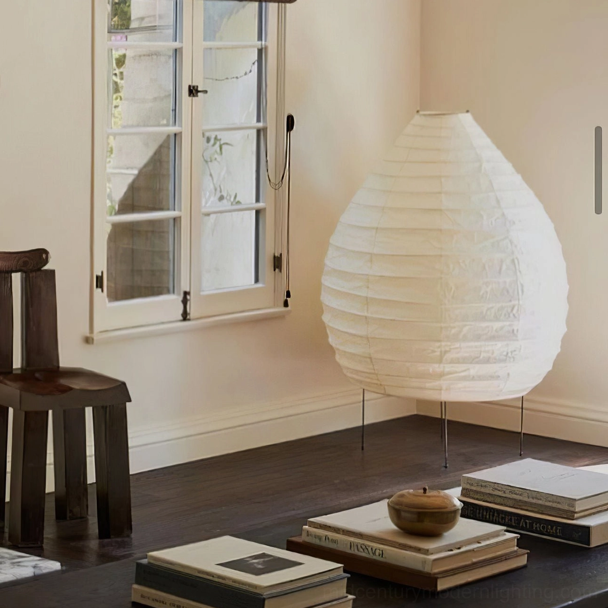 Minimalist bright interior with handcrafted washi paper table lamp on wooden furniture
