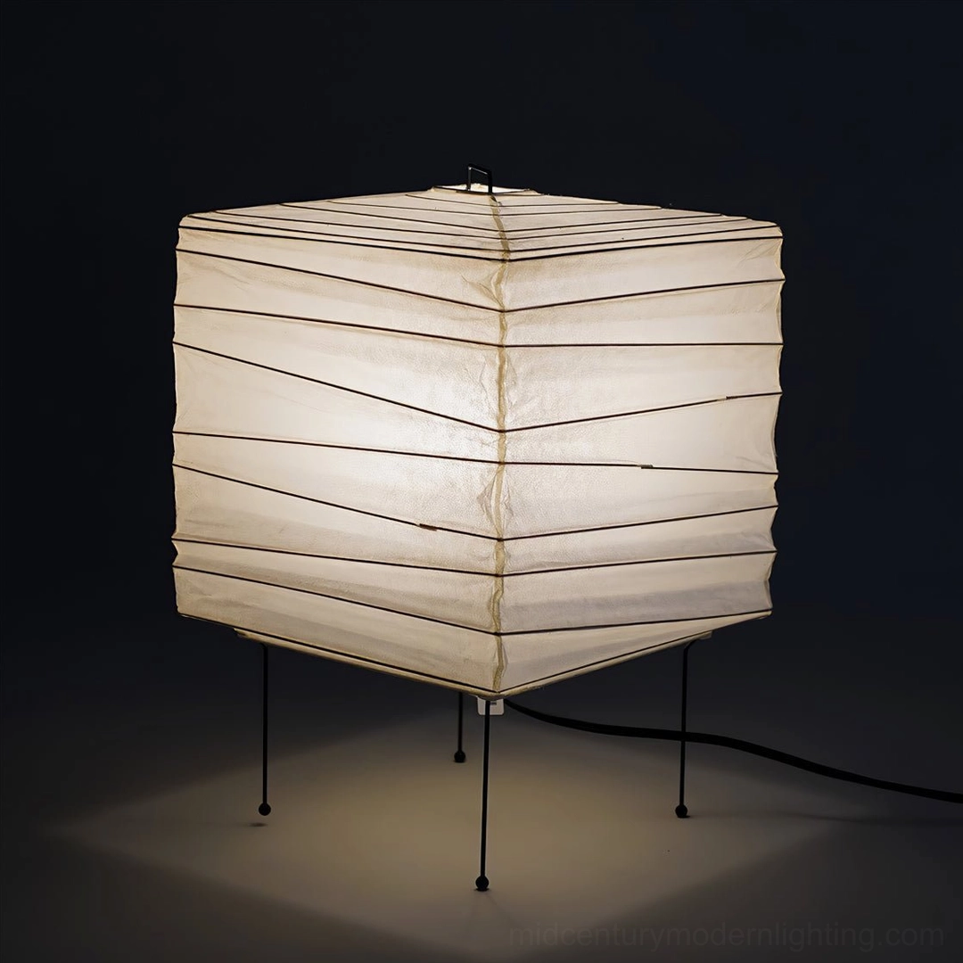 Organic washi paper table lamp shade detail showing handmade mulberry paper texture and perforated eye-like apertures for ambient light diffusion