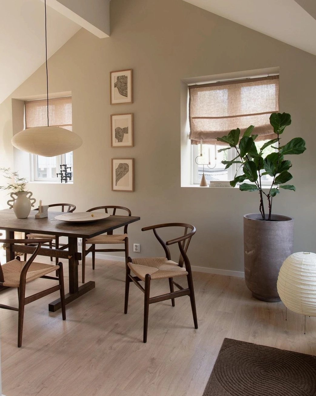 Bar counter illuminated by washi pendant creating focused warm gathering point in residential interior