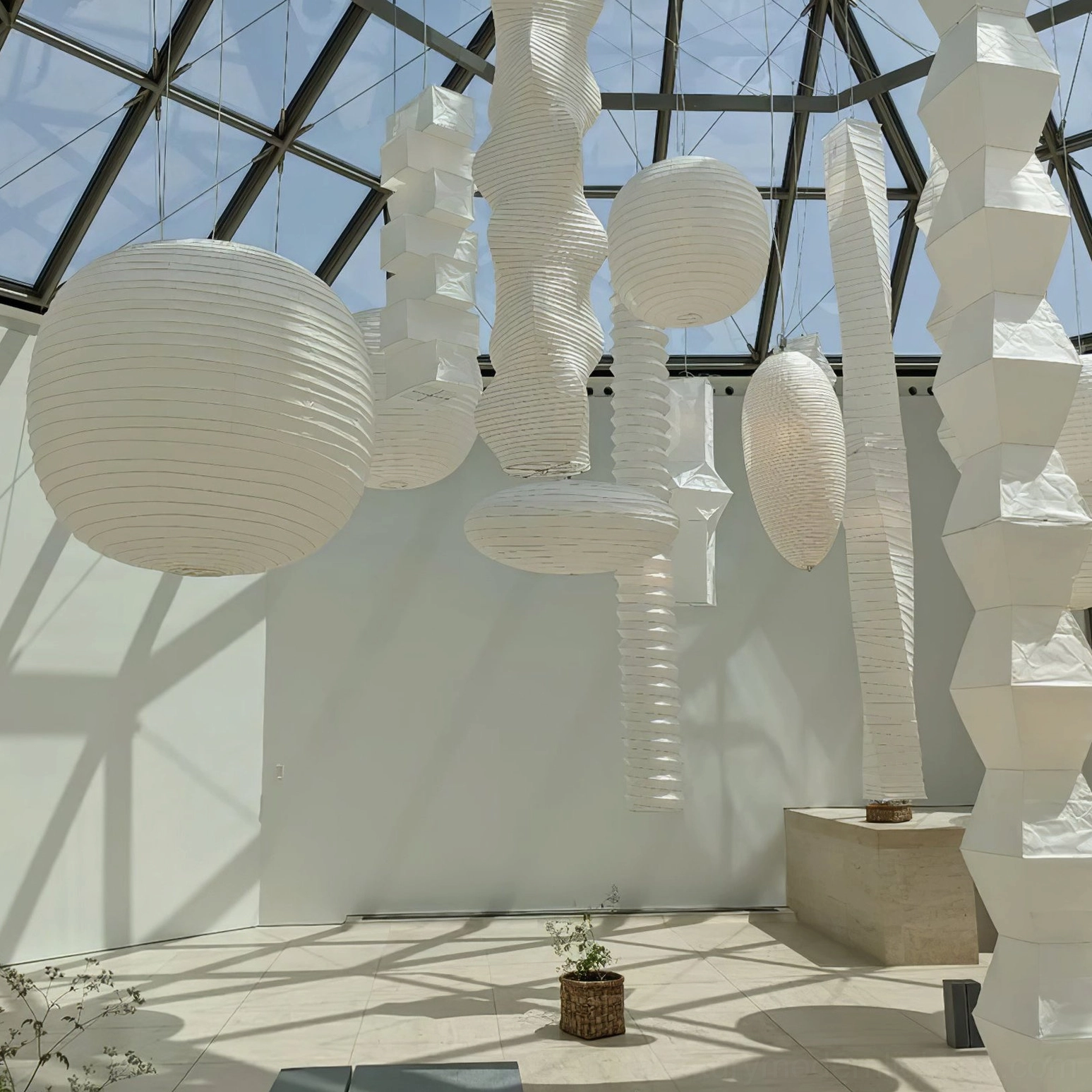 Washi paper pendant light with cord extension visible for high ceiling installation clearance