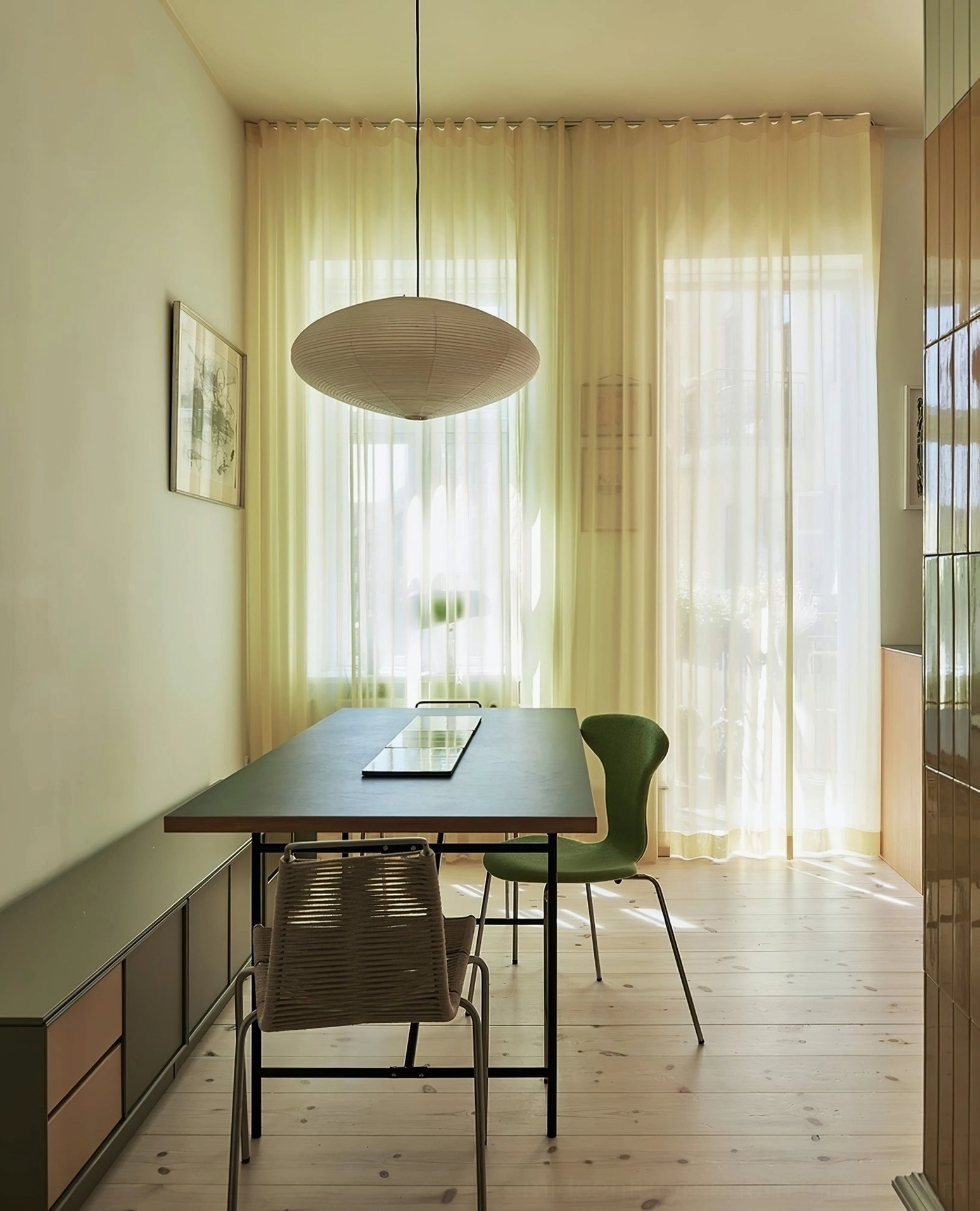 Washi paper pendant light in home office creating warm focus without harsh glare on workspace