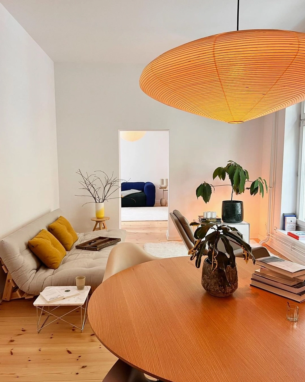 Hotel lobby interior featuring large washi pendant as statement focal point lighting installation