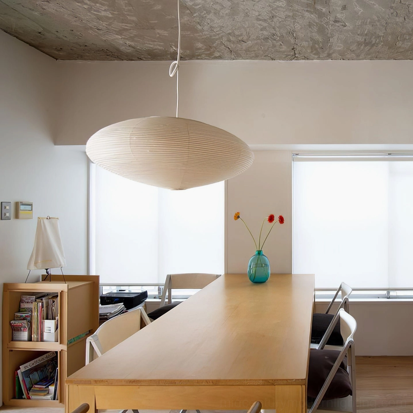 Japandi style bedroom featuring washi pendant light as meditative calm design element