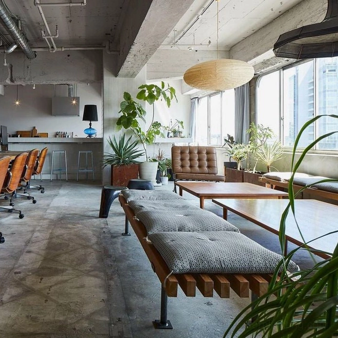 Wide panoramic interior view of washi pendant light in commercial open-plan space with industrial-modern design aesthetic