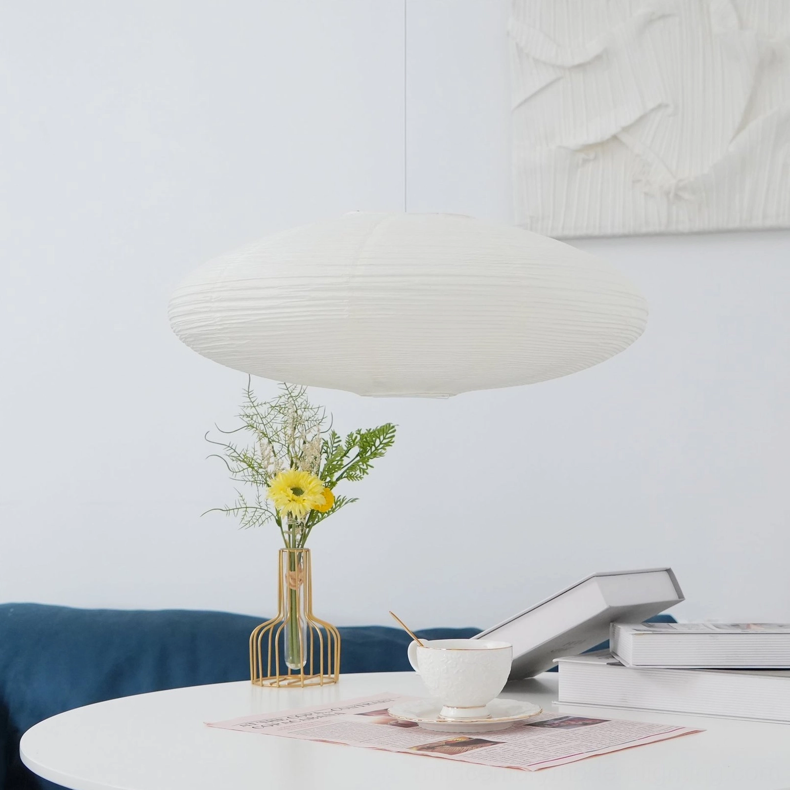Washi paper pendant light in contemporary Scandinavian interior with minimalist furnishings