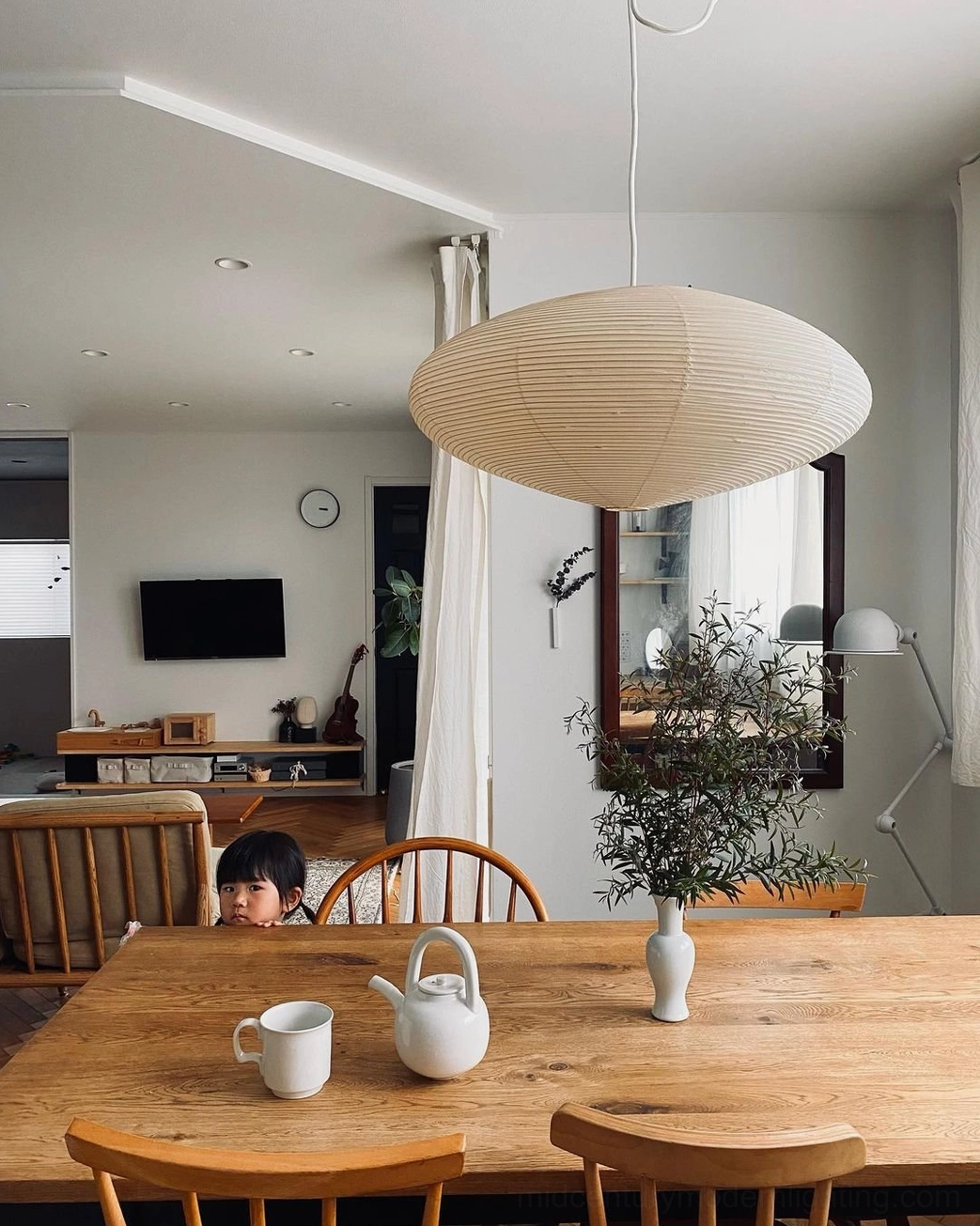 Traditional Japanese shoji screen detail inspired by washi pendant light's design philosophy