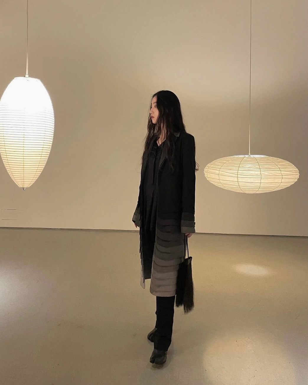 Zen meditation space with washi pendant light creating peaceful introspective ambiance