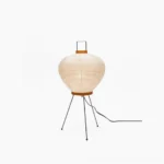 Washi tripod table lamp with white mulberry paper shade and black metal frame, frontal studio view on white background