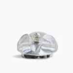 Wave mid-century modern table lamp with polished chrome base and clear glass shade, studio view