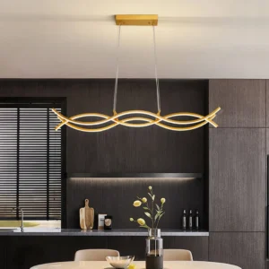Brushed gold wave pendant lighting above dark wood dining table in contemporary kitchen with ambient warm light