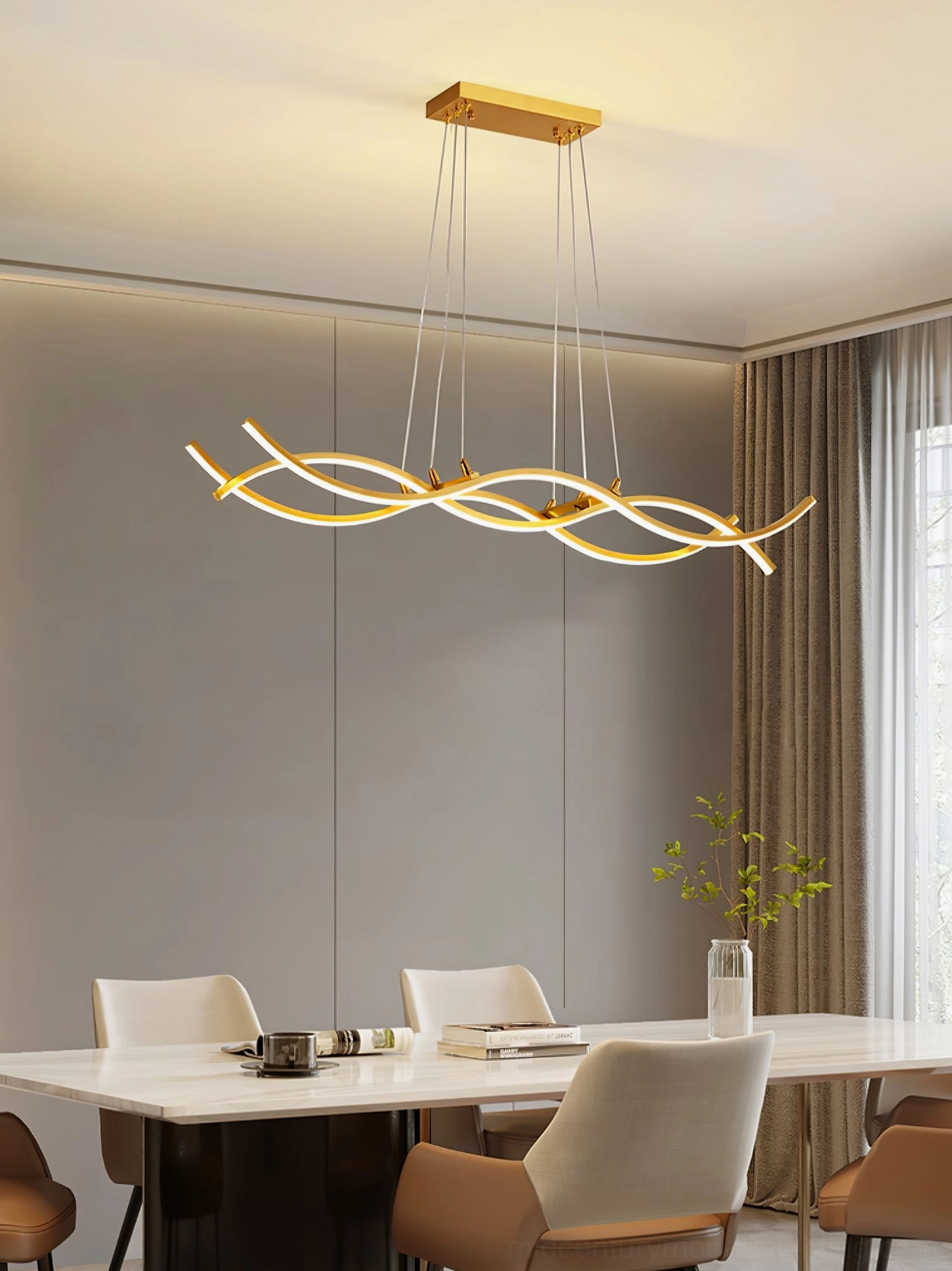 Brushed gold wave chandelier in neutral minimalist dining room with long table and modern chairs