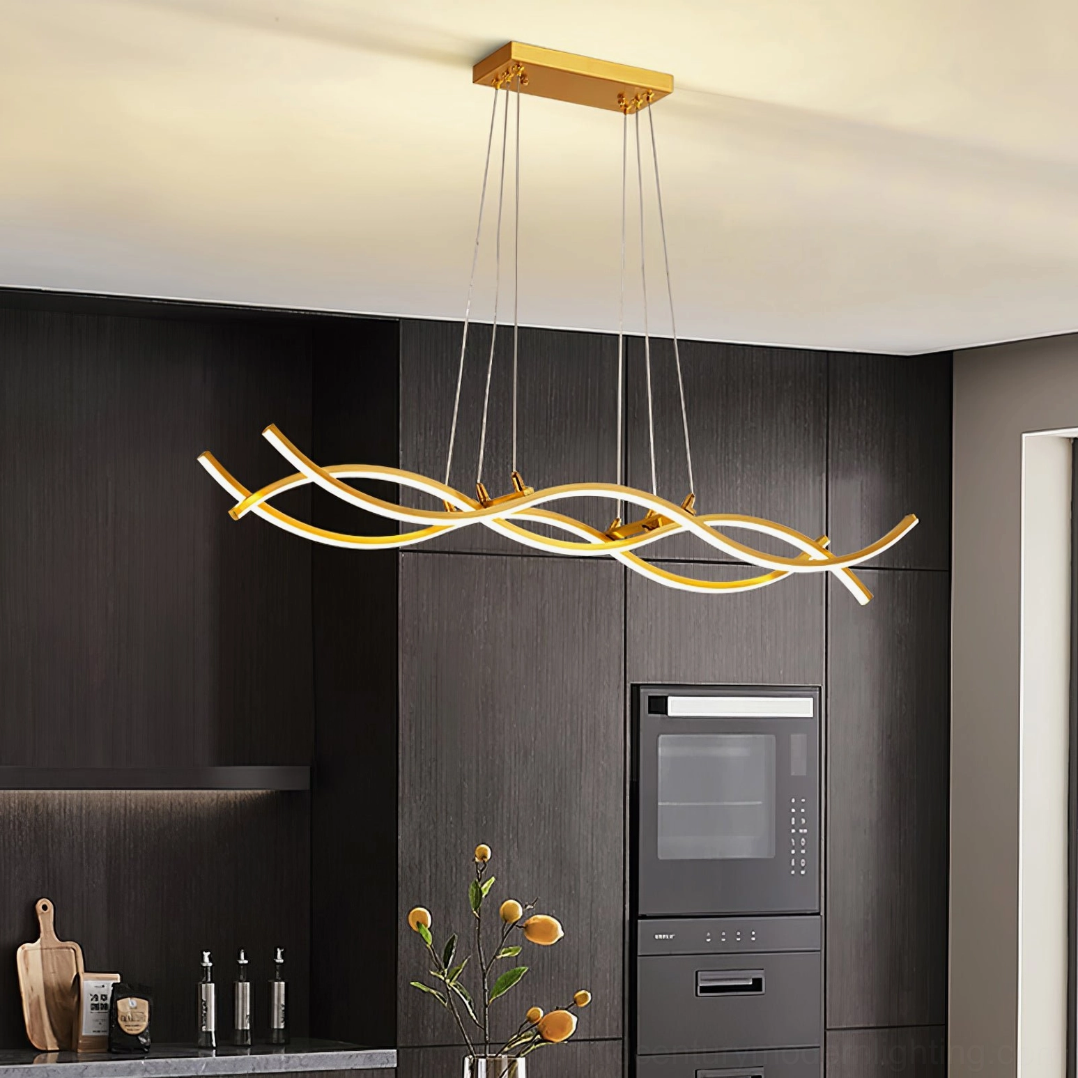 Wave linear LED pendant chandelier in minimalist modern kitchen with built-in appliances