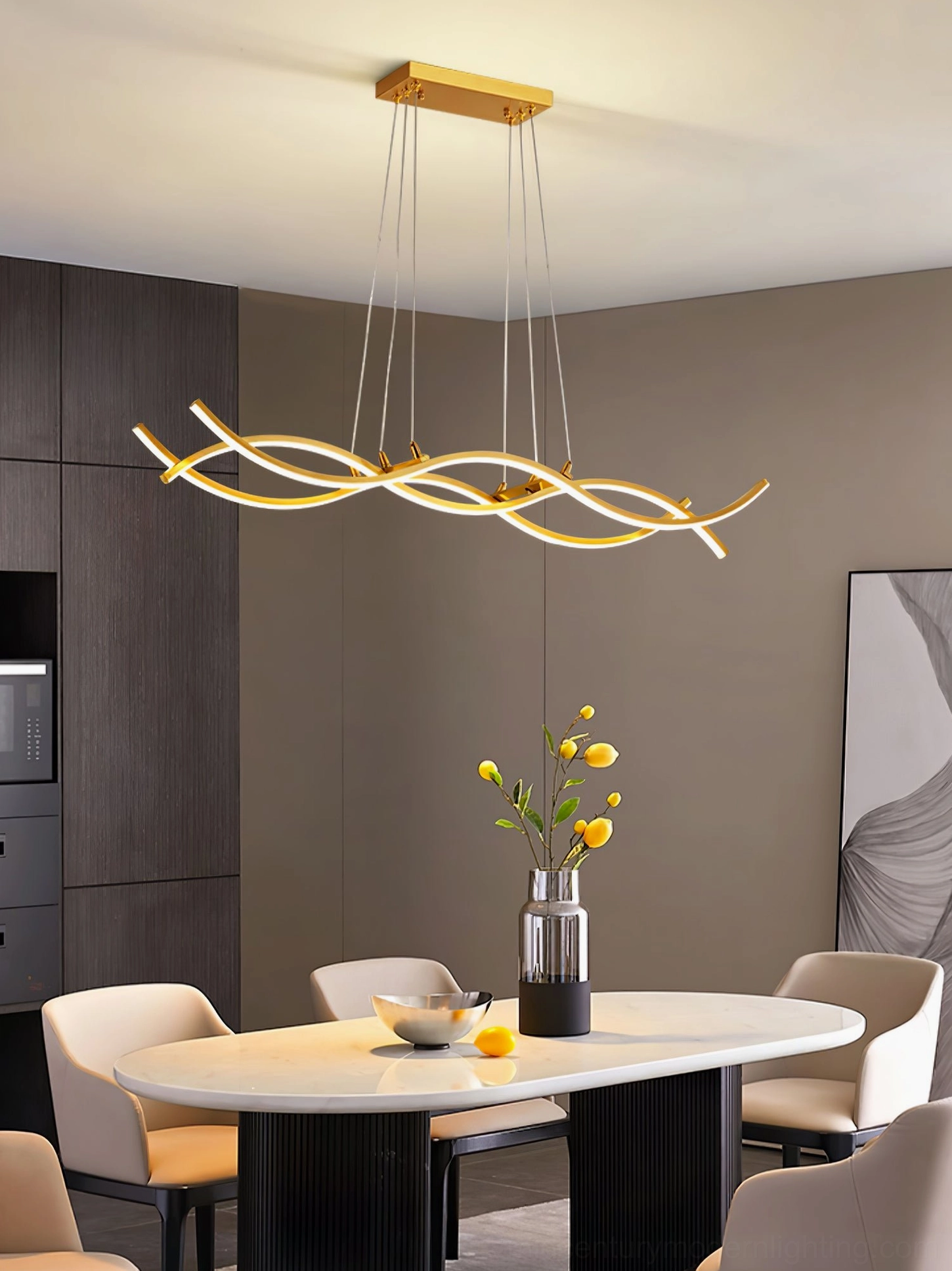 Wave pendant LED chandelier above round dining table with flower arrangement in warm-toned room