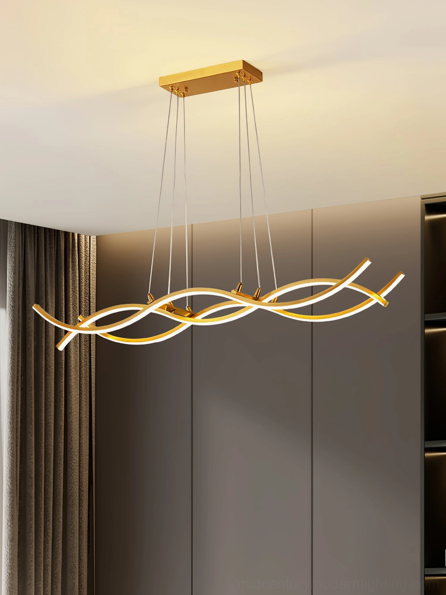 Wave Island LED chandelier creating ambient lighting in contemporary residential dining area