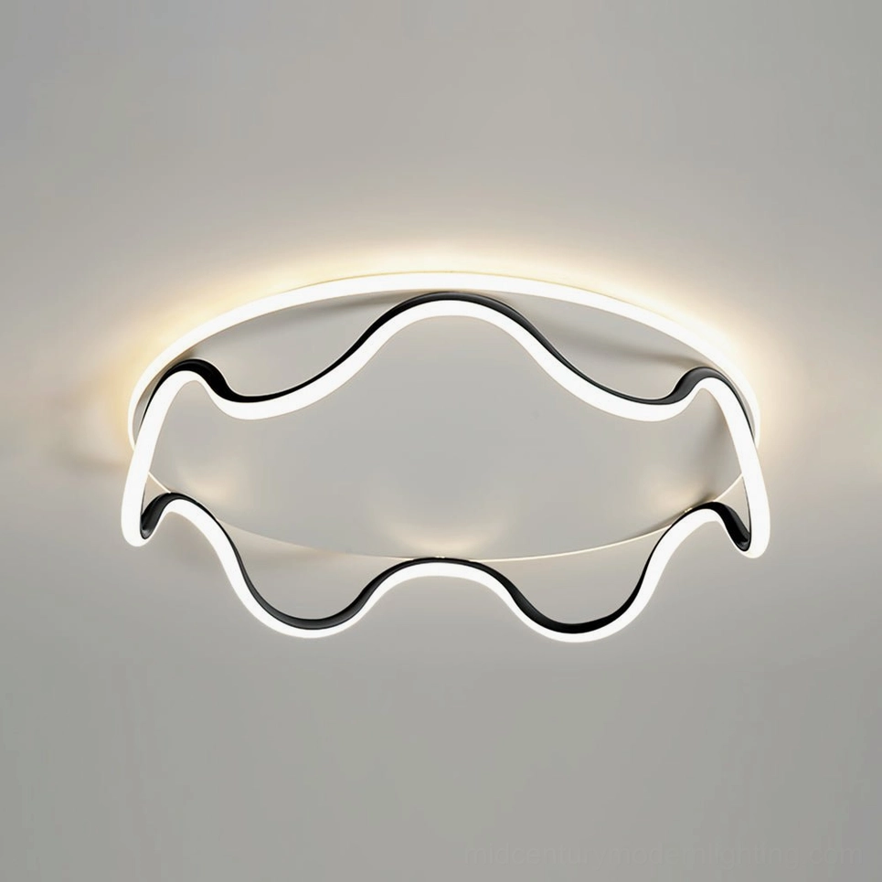 Low-angle view of contemporary wavy LED ceiling light with warm backlight and black metal trim installed on white ceiling