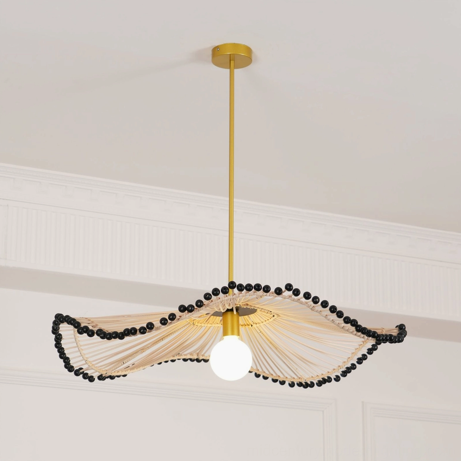 Three-quarter view of handwoven rattan pendant chandelier highlighting sculptural form and craftsmanship