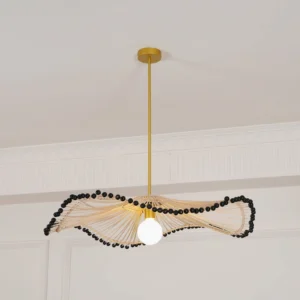 Long wavy rattan pendant chandelier installed in minimalist white room demonstrating bohemian lighting aesthetic