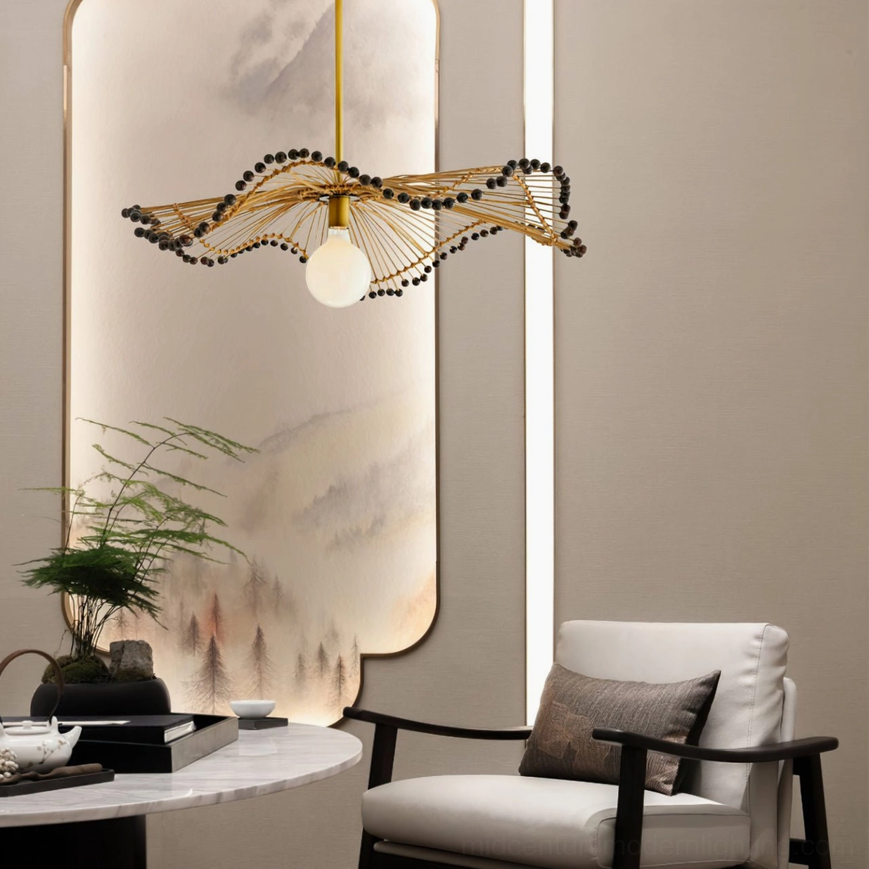 Waverly rattan chandelier illuminated in living room with accent chair demonstrating ambient lighting