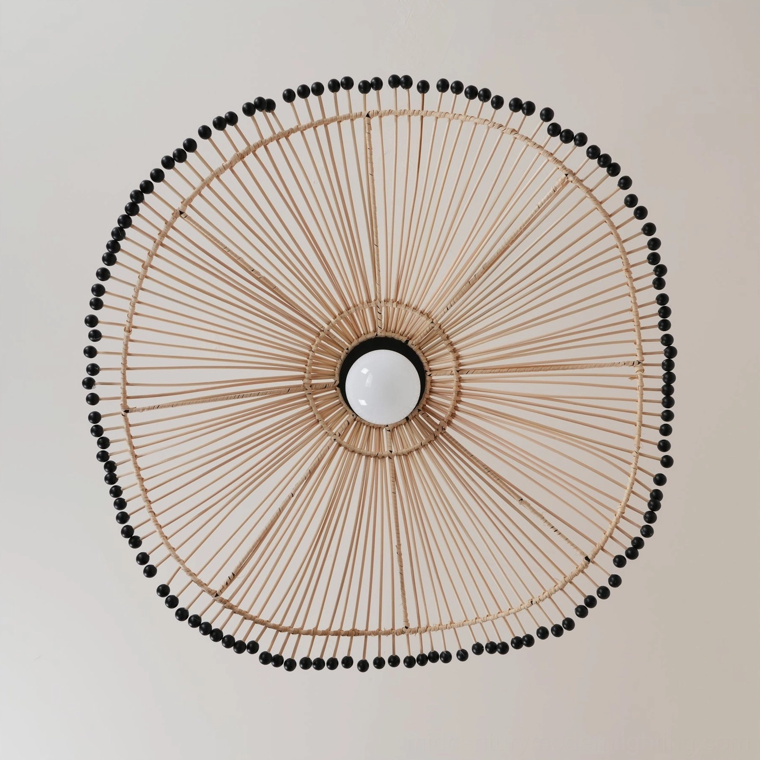 Rattan circular wall art decor piece featuring same handwoven design as Waverly pendant light